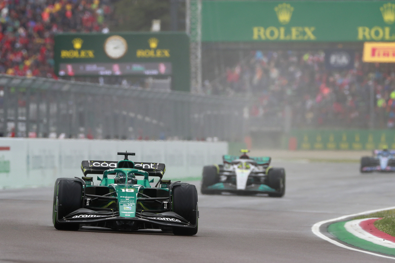Lance Stroll, Aston Martin AMR22, leads Sir Lewis Hamilton, Mercedes W13