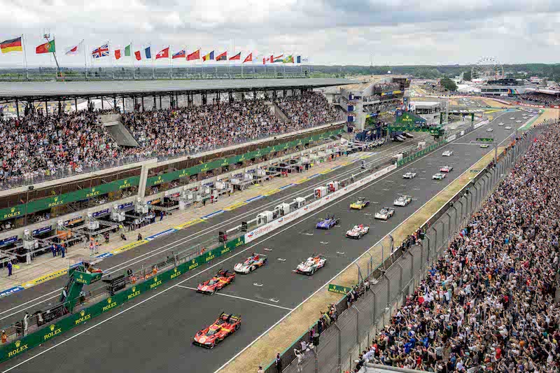 Cars cross the start line to begin the race 