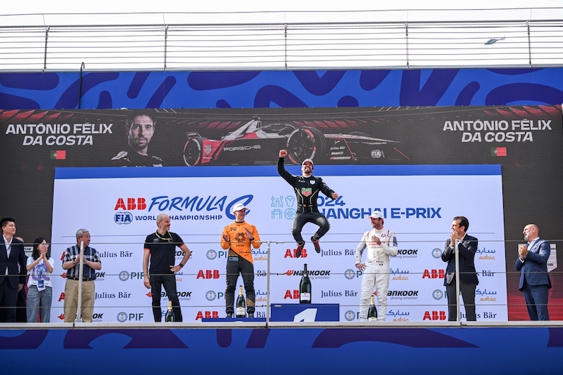 Antonio Felix da Costa, TAG Heuer Porsche Formula E Team, 1st position, jumps in celebration on the podium as Jake Hughes, NEOM McLaren Formula E Team, 2nd position, and Norman Nato, Andretti Global, 3rd position, look on (Antonio Felix da Costa, TAG 