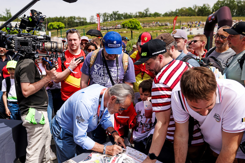 Jacky Ickx signs autographs for fans
