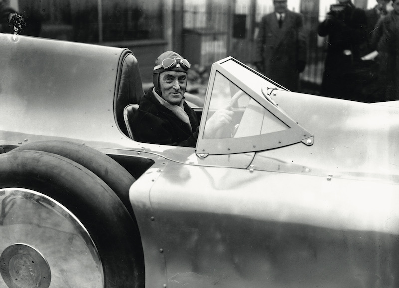 January 1935:  Sir Malcolm Campbell sitting in his new Bluebird car at Brooklands. (Photo by Fox Photos/Getty Images)