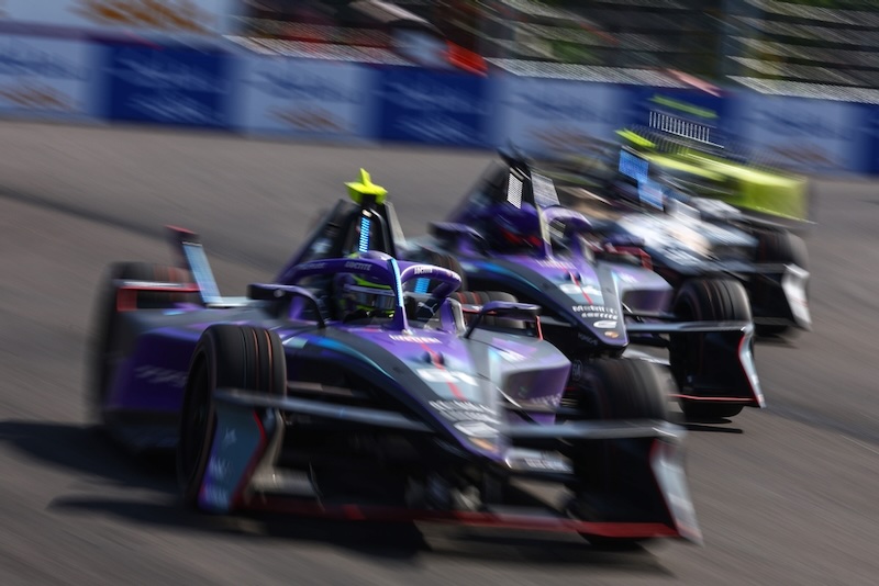 SANYA, CHINA - JUNE 20: Nico Muller of Switzerland driving the (51) Porsche Formula E Team Porsche 99X Electric leads Pascal Wehrlein of Germany driving the (94) Porsche Formula E Team Porsche 99X Electric during the Sanya E-Prix, Round 11 of the 2026 FIA Formula E World Championship at Sanya Street Circuit on June 20, 2026 in Sanya, China. (Photo by Joe Portlock/LAT Images)